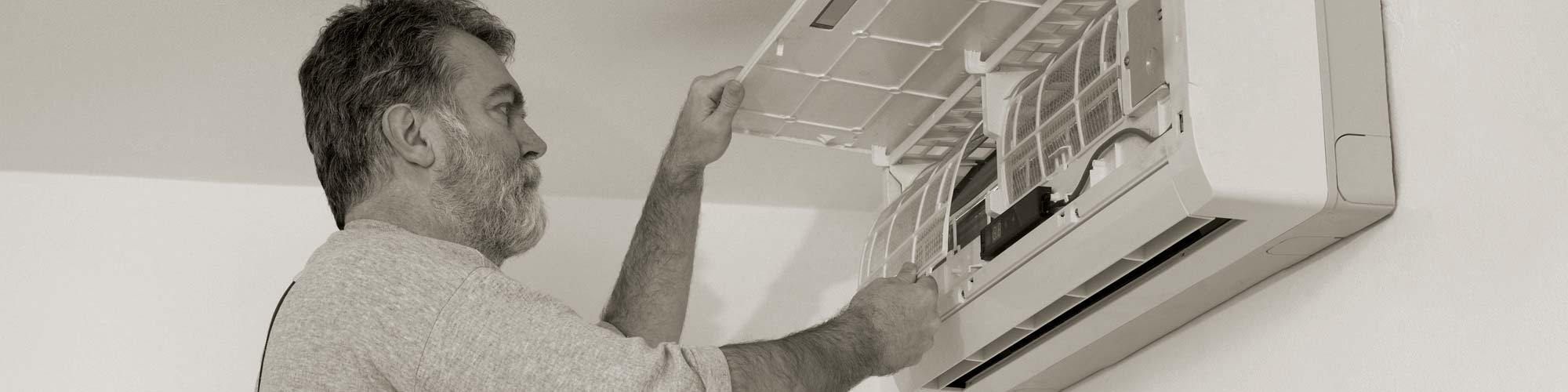 Man Checking Split HVAC Unit